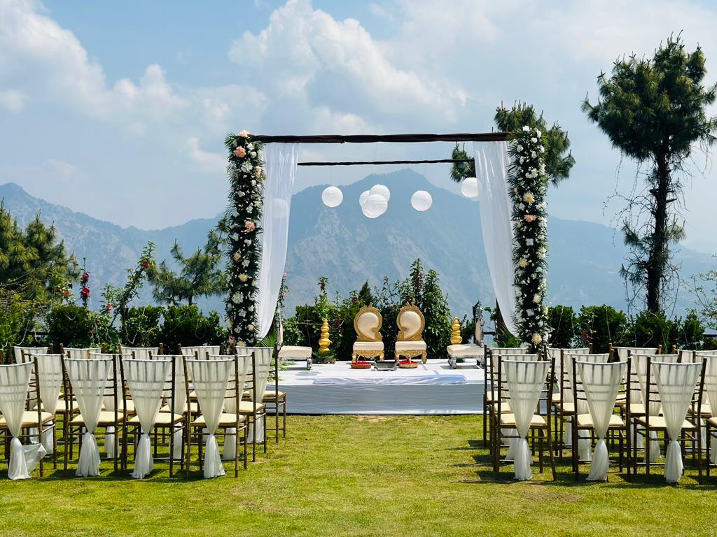 floral wedding mandap with mountain backdrop
